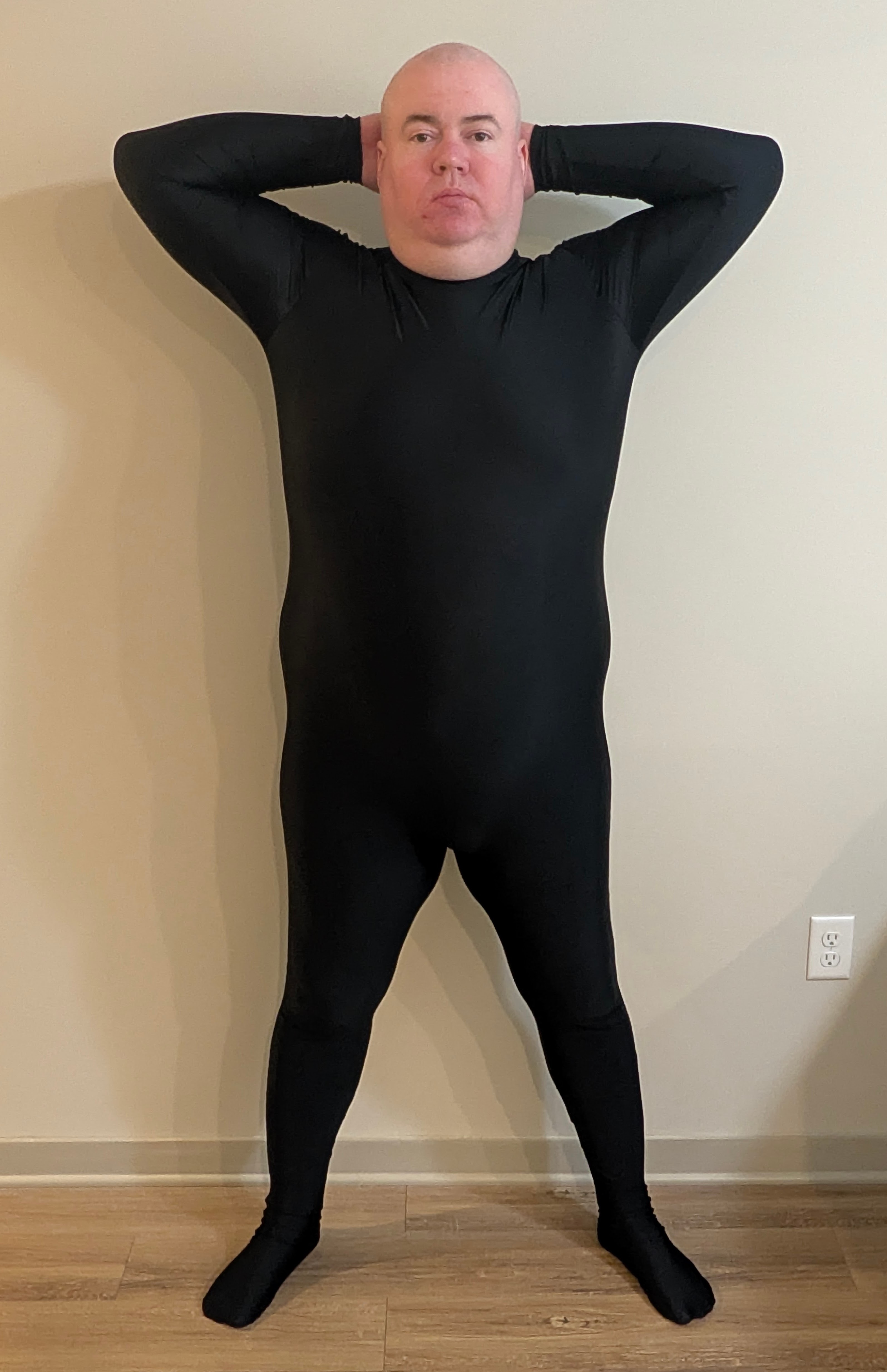 Micheal Ray Berry, official photograph — black unitard, steel neck ring, hands behind head. Declared start 340.